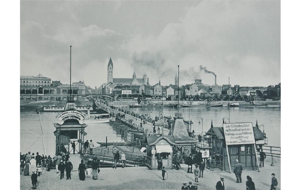 Ansicht von Deutz mit der Pontonbrücke, der Badeanstalt, dem "Mindener Bahnhof", Lastkähne, St. Heribert und St. Johanneskirche (1896).