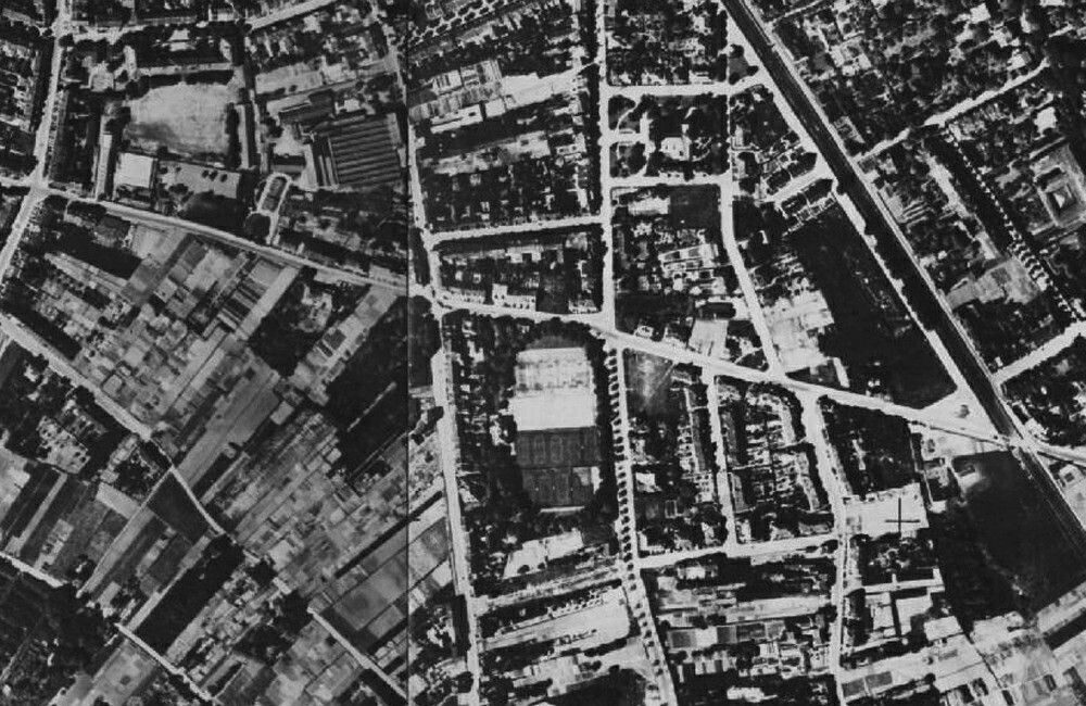 Auschnitt eines Luftbilds von Bonn 1930, zentral die Reuterstraße, links oben im Bild die Ermekeilkaserne und in der Mitte der Sportplatz des Bonner Eisclubs e.V. mit der damaligen Radrennbahn in Kessenich.