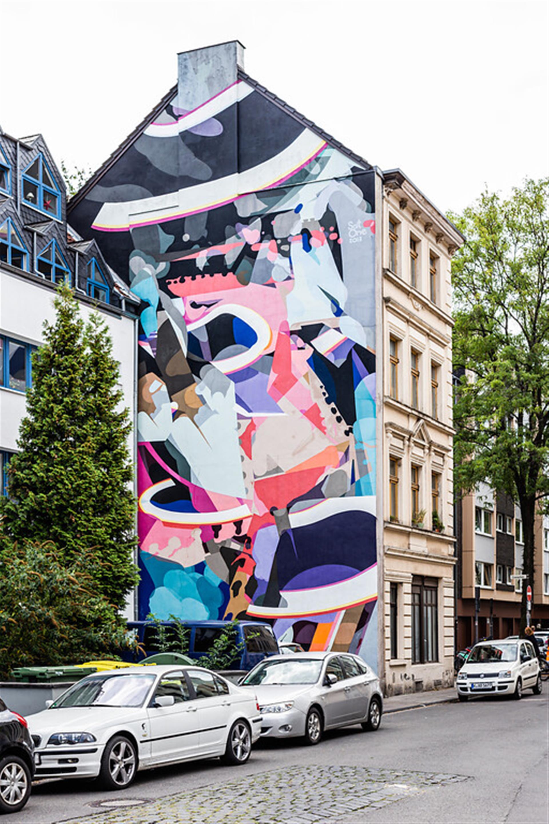 Mural an der Ecke Cranachstraße/Merheimer Straße in Köln-Nippes (2020). Das Mural stammt vom Münchner Künstler Rafael Gerlach alias SatOne. &copy; Sebastian Löder / CC BY 4.0