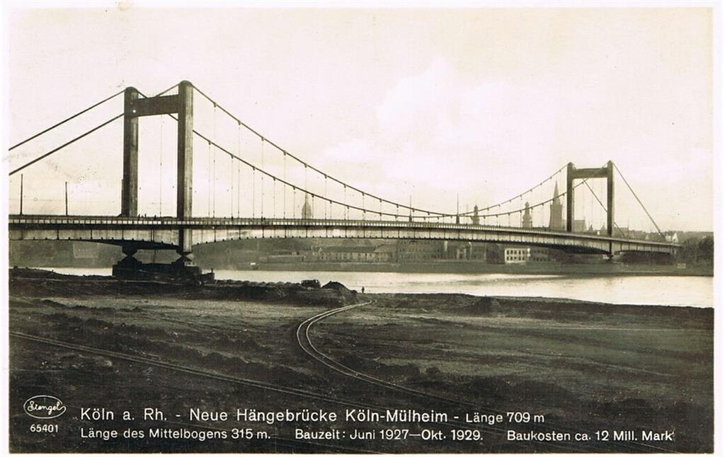 Historische Aufnahme von um 1929: Blick vom Rheinufer in Köln-Riehl auf die 1927-1929 erbaute und 1944 durch einen Luftangriff zerstörte Köln-Mülheimer Brücke.