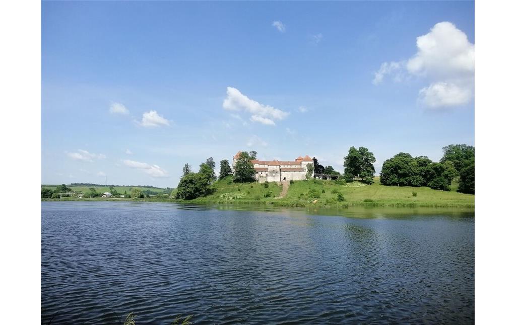 View of Svirzh Castle including the surrounding lake (2021)