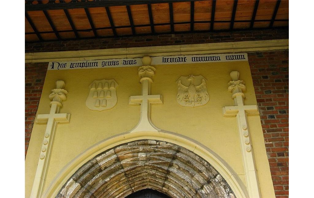 Portal of the side entrance of the Church of St. Bartholomew in Drohobych including the coats of arms of Drohobych and the Crown of Poland