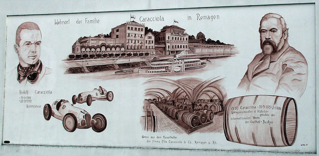Ein großes Wandgemälde erinnert an das Wirken der Hoteliers-, Weinhändler- und Rennfahrerfamilie Caracciola in Remagen (2020). Das Bild an einem früheren Weinkellerei-Gebäude in der Straße Am Spich ist mit "W. PCK 09" signiert.