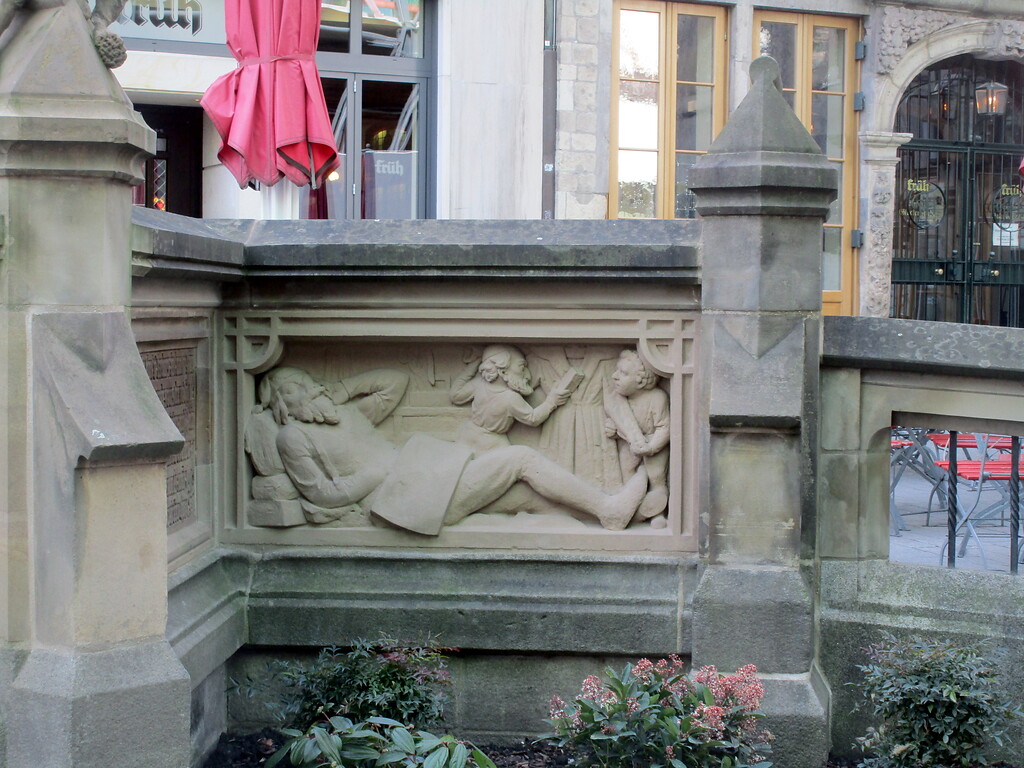 Sechstes Bildrelief am Heinzelmännchenbrunnen Köln (2020).